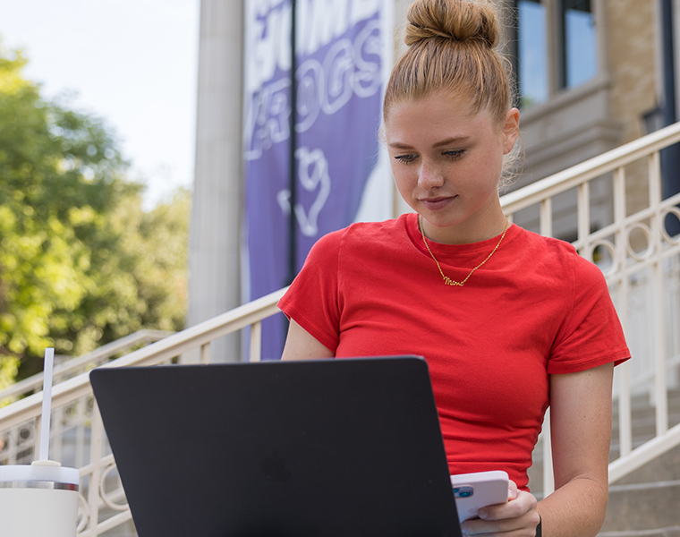 TCU student working on laptop
