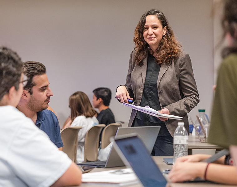 Dr. Arguello, Cinema of Latin America teaching in her classroom