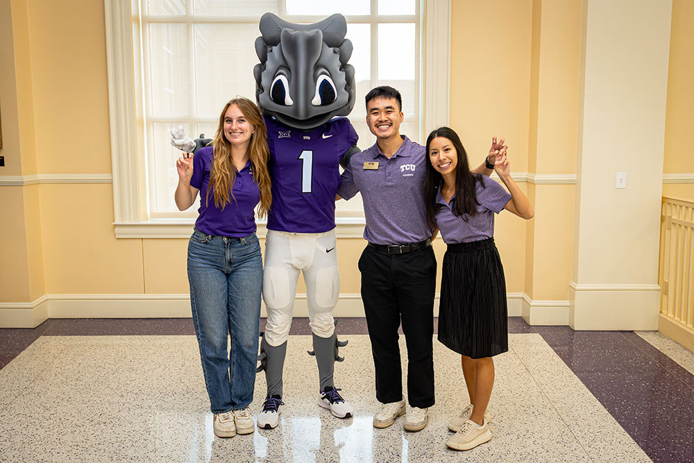 TCU counselors, student and superfrog mascot