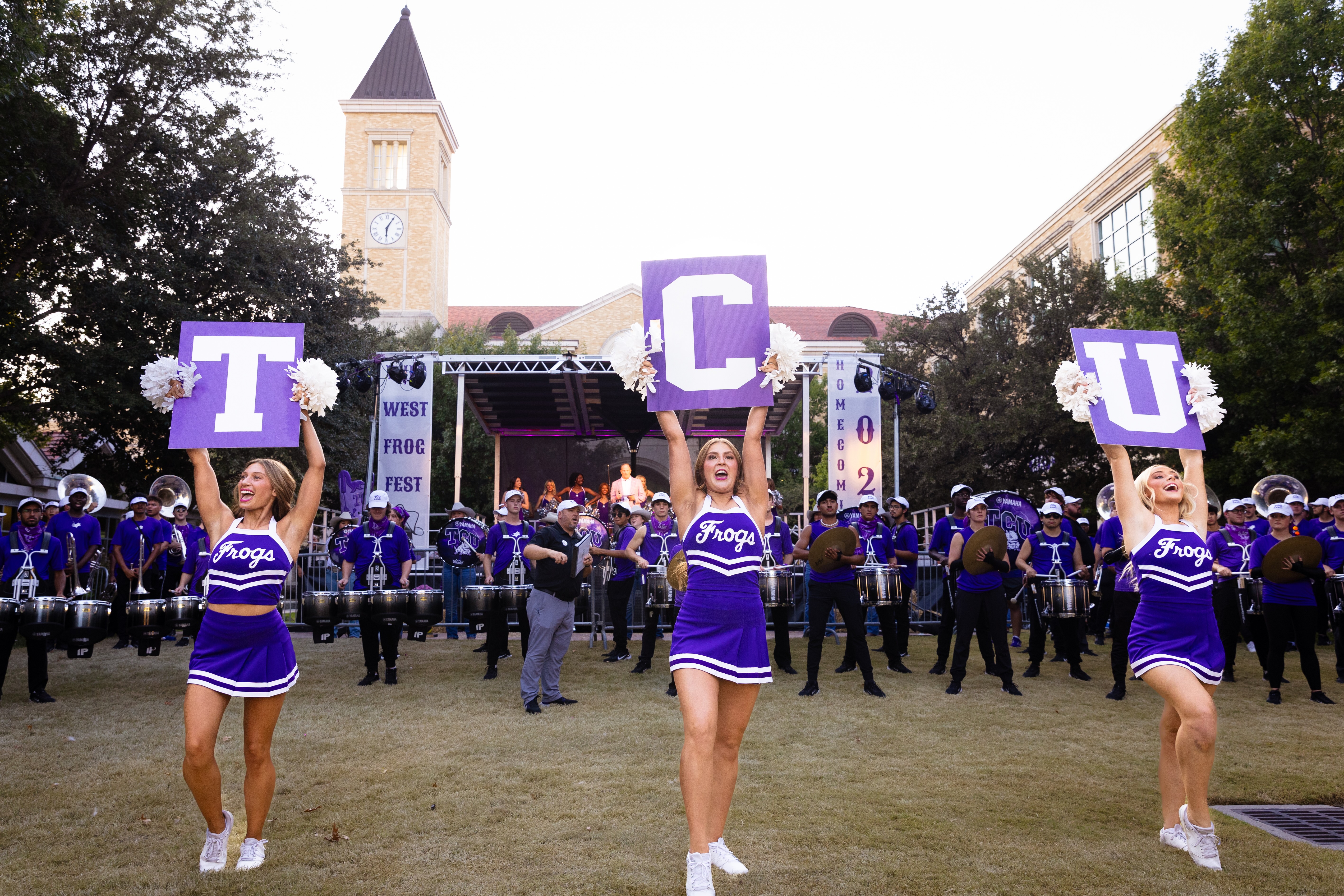 TCU cheerleaders and marching band perform during 