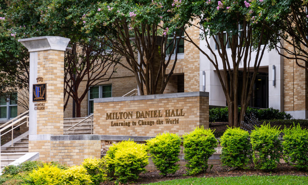 TCU John V. Roach Honors College sign outside Milton Daniel Hall, the Honors residence hall
